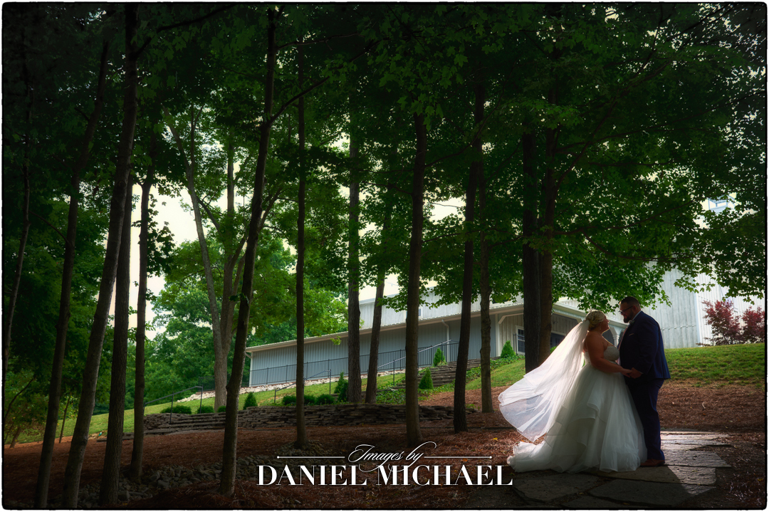 Couple standing in woods